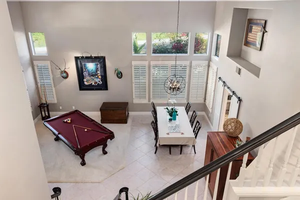 a spacious bedroom with a large bed and a large window