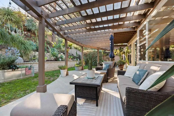 a view of patio with a table and chairs