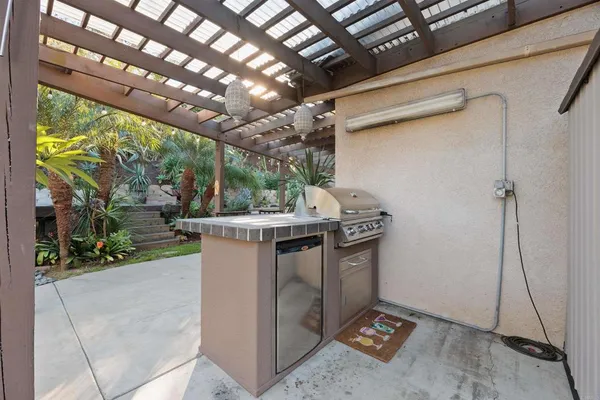 a view of a backyard with sitting area