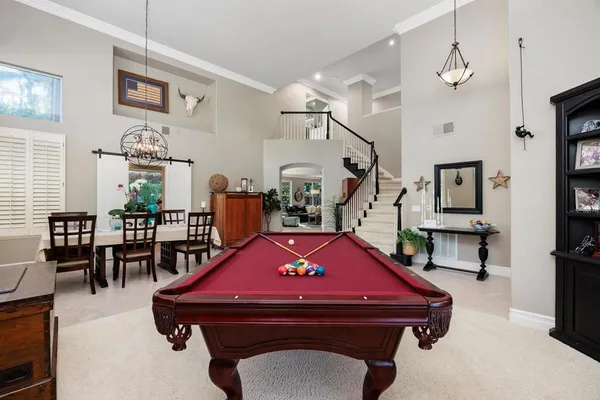 a view of a dining room with furniture window and outside view