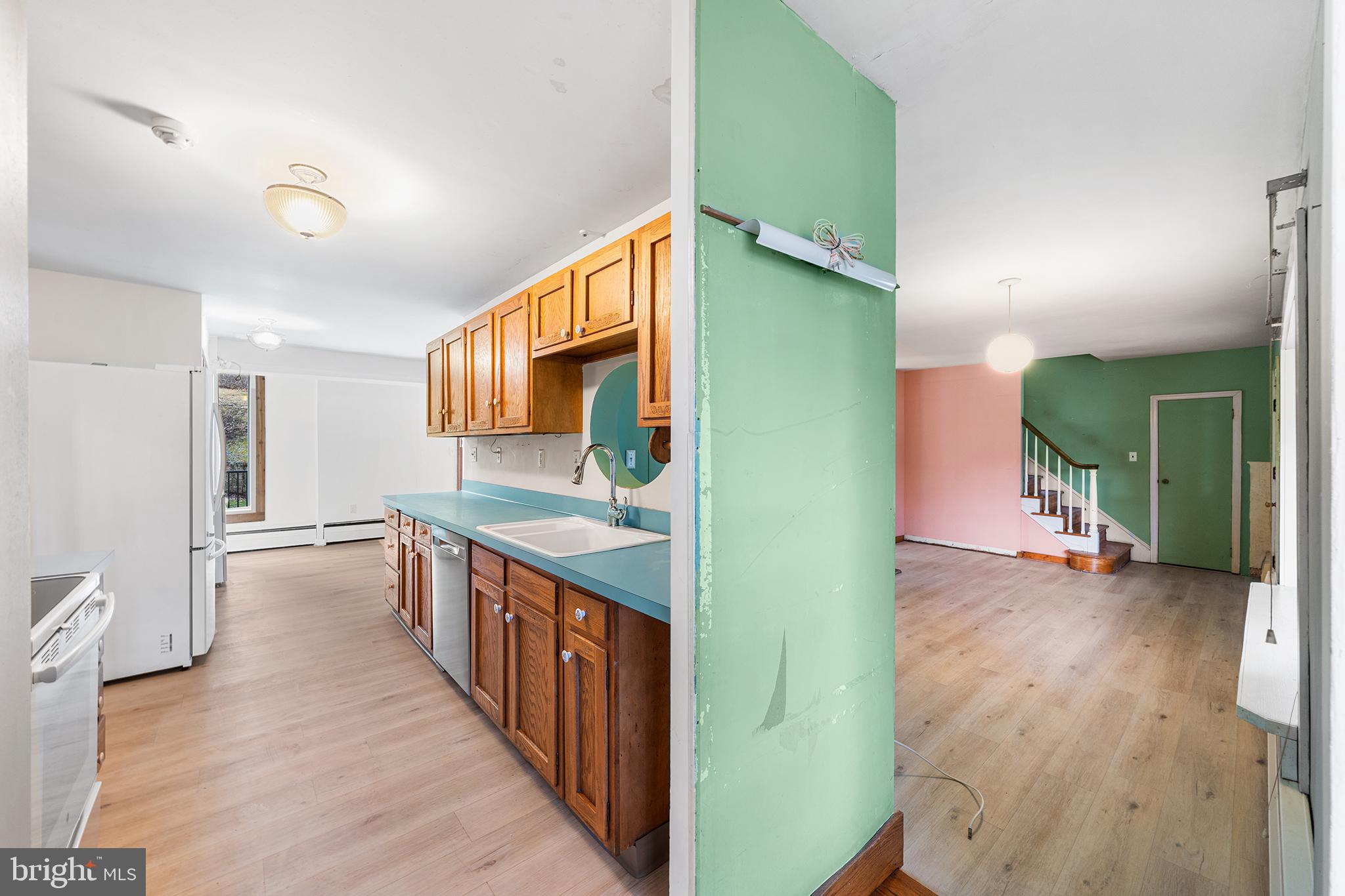 906 Hunt Road Newtown Square, PA 19073 - Photo 13 of 40 a kitchen with stainless steel appliances granite countertop a refrigerator and a sink