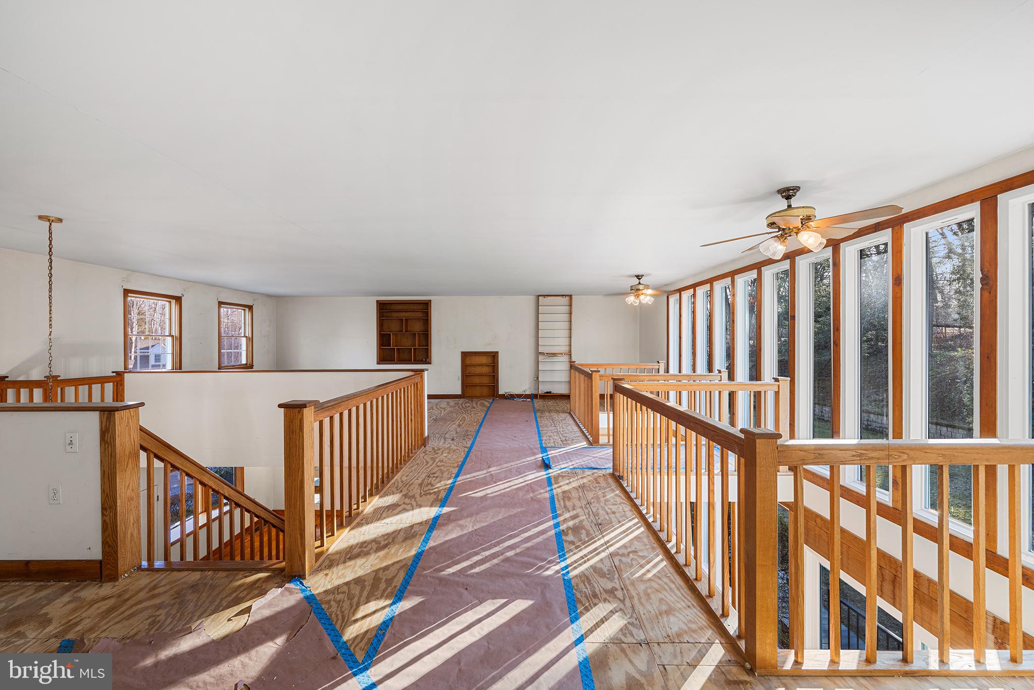 906 Hunt Road Newtown Square, PA 19073 - Photo 22 of 40 a view of staircase with wooden floor and a window