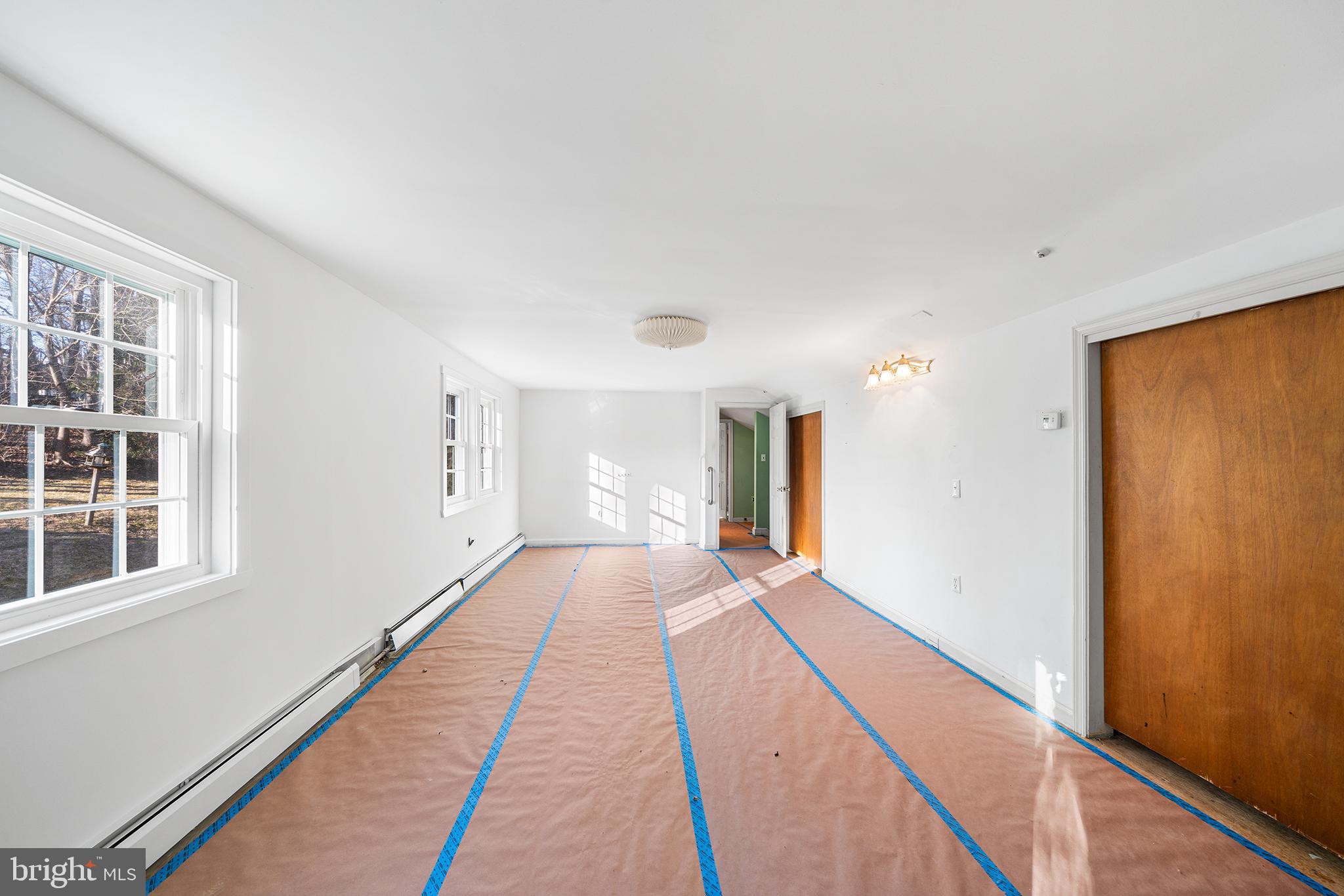 906 Hunt Road Newtown Square, PA 19073 - Photo 26 of 40 a hallway with windows and wooden floor