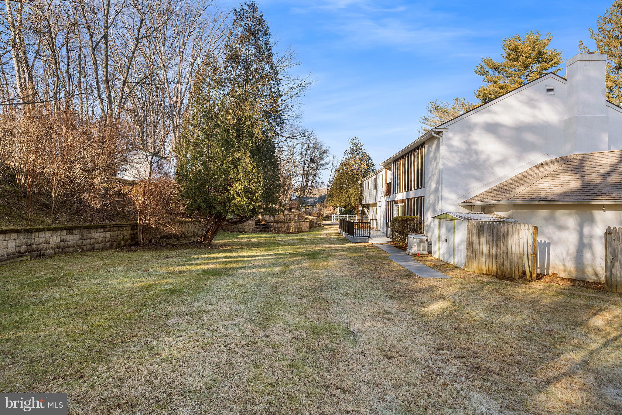 906 Hunt Road Newtown Square, PA 19073 - Photo 3 of 40 a view of road with large trees