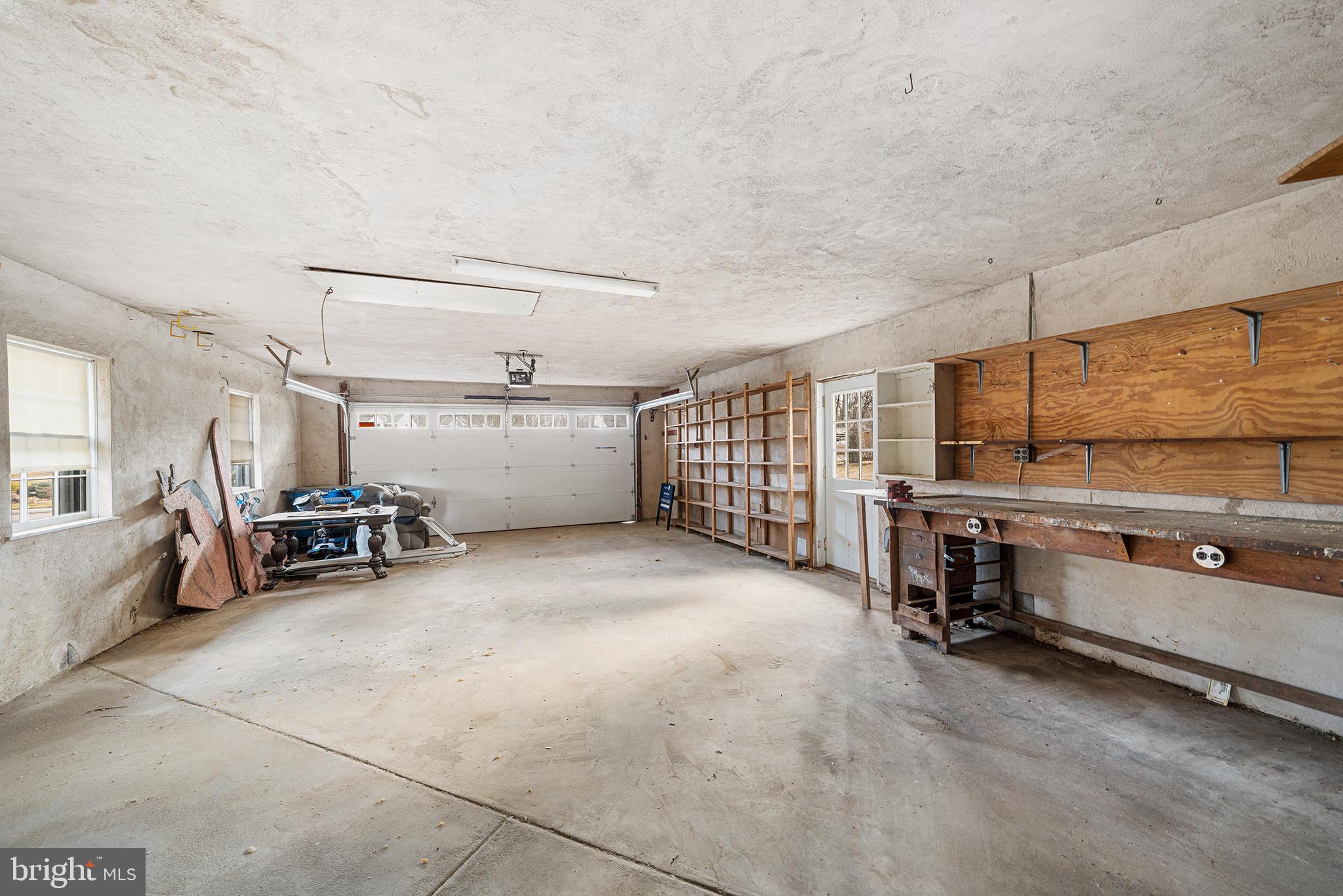 906 Hunt Road Newtown Square, PA 19073 - Photo 30 of 40 a view of a garage with furniture and storage