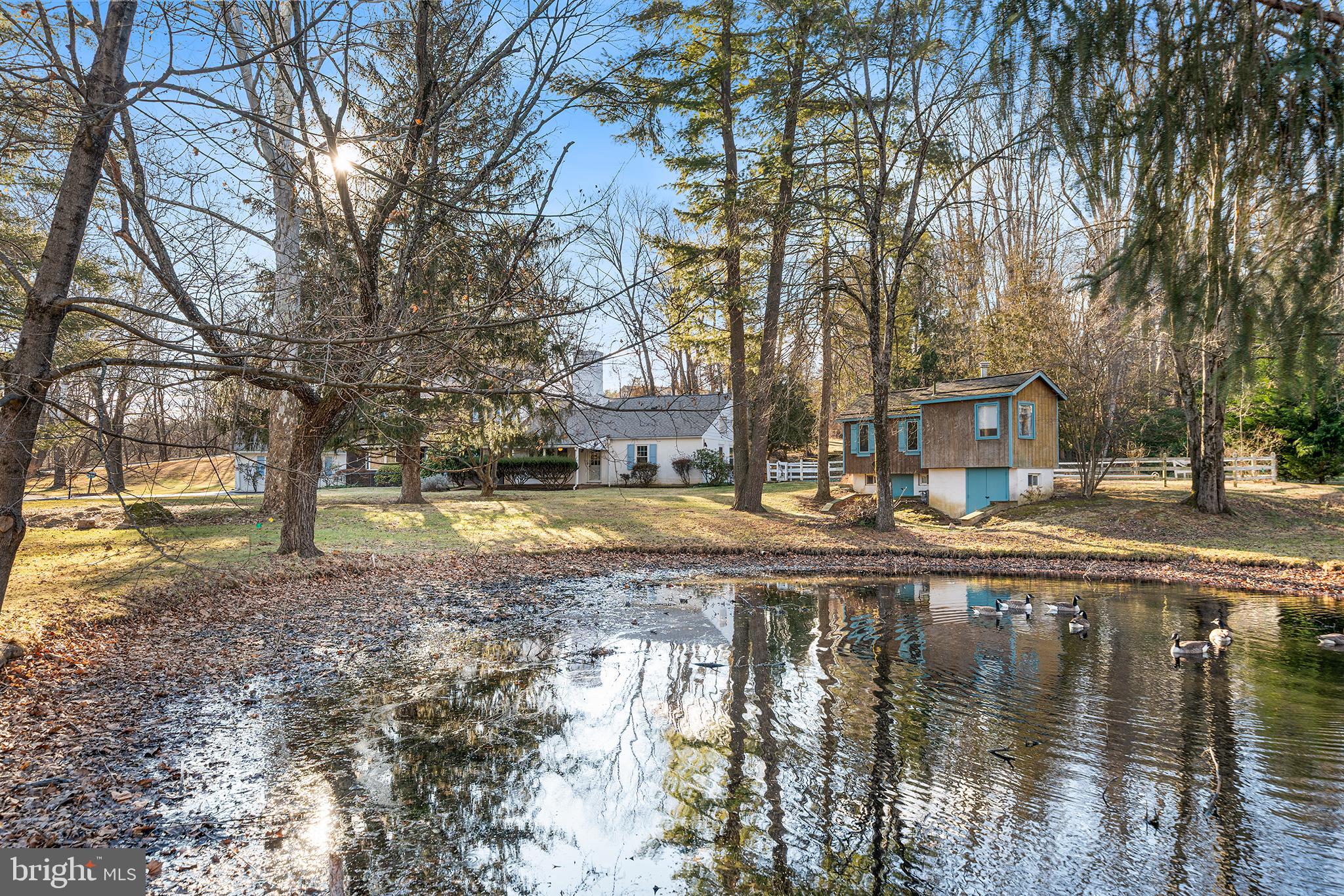 906 Hunt Road Newtown Square, PA 19073 - Photo 39 of 40 a view of swimming pool with trees and buildings