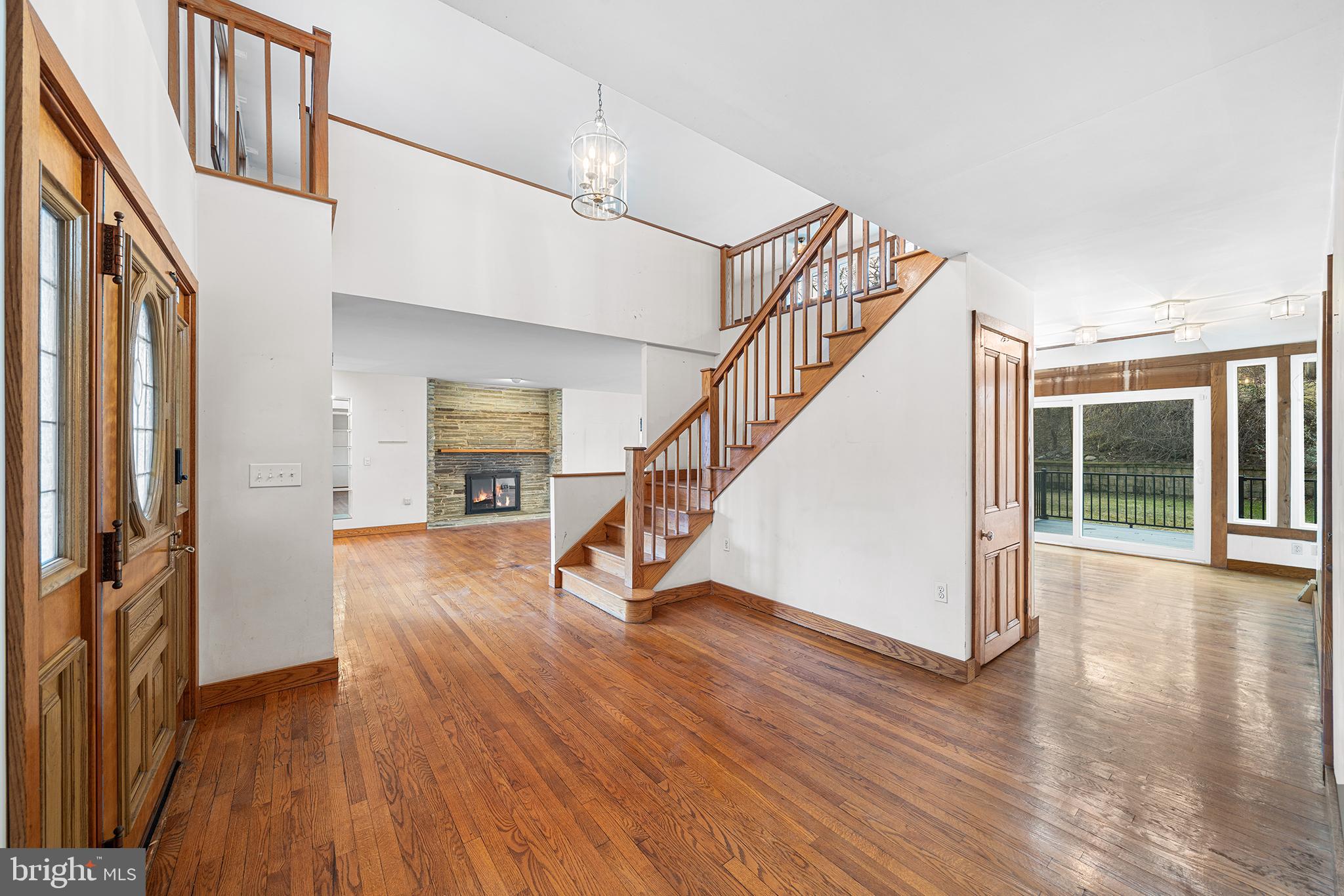 906 Hunt Road Newtown Square, PA 19073 - Photo 4 of 40 a view of an entryway with wooden floor and door