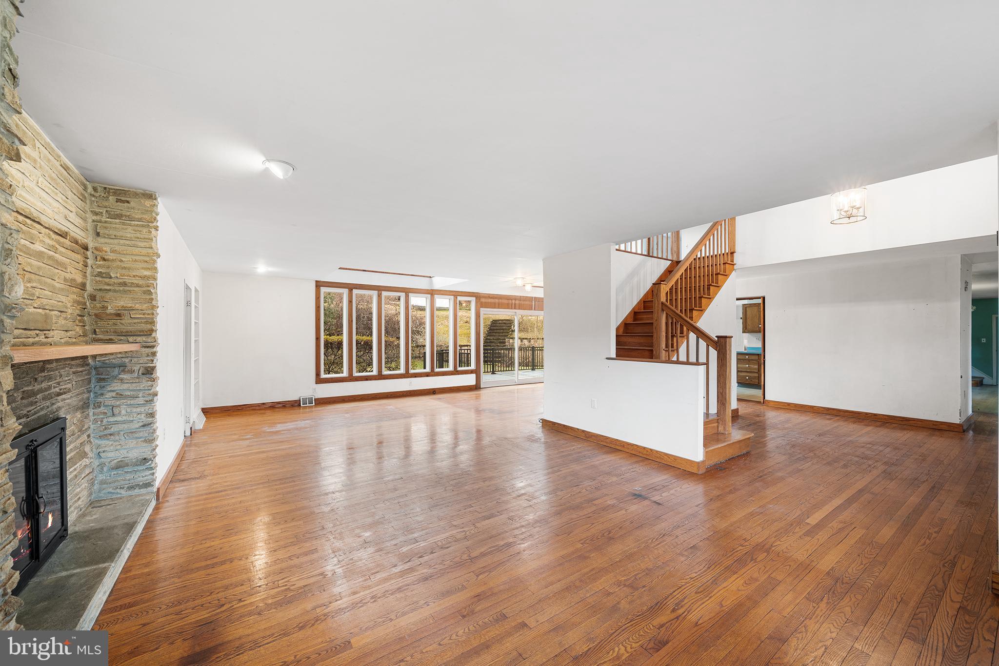 906 Hunt Road Newtown Square, PA 19073 - Photo 40 of 40 a view of an empty room with wooden floor and a window