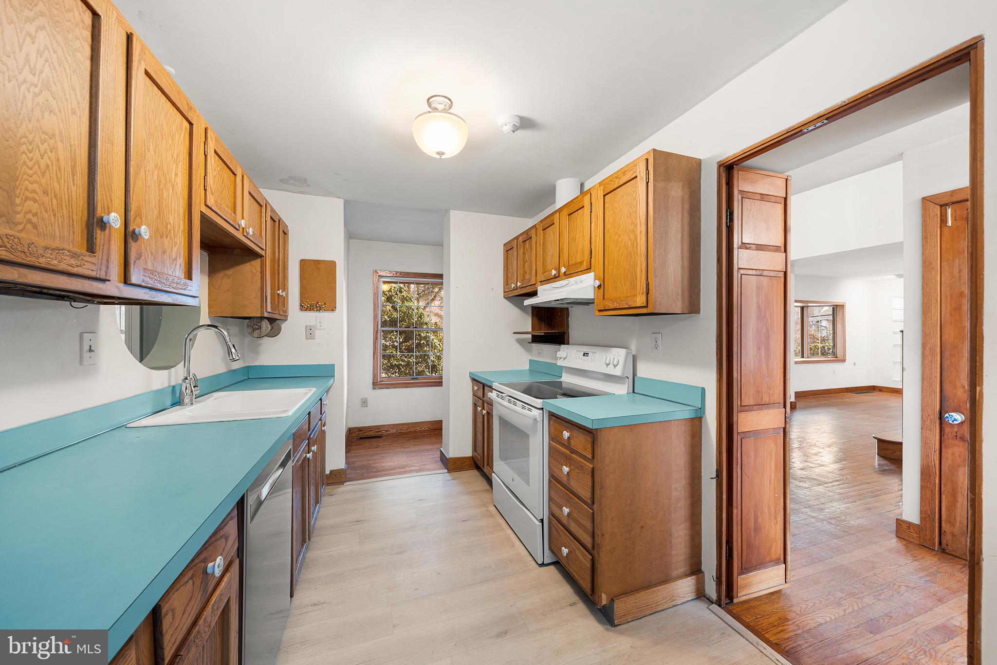 906 Hunt Road Newtown Square, PA 19073 - Photo 8 of 40 a kitchen with stainless steel appliances granite countertop a stove and a sink