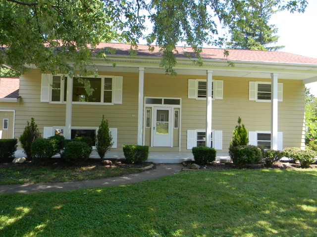 169 Swanson Road Sycamore, IL 60178 - Photo 1 of 11 a view of a house with a yard and plants
