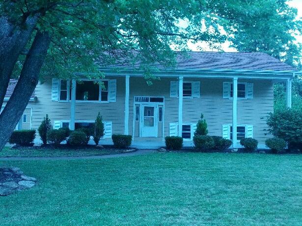 169 Swanson Road Sycamore, IL 60178 - Photo 2 of 11 a view of a brick house with a yard and a large tree