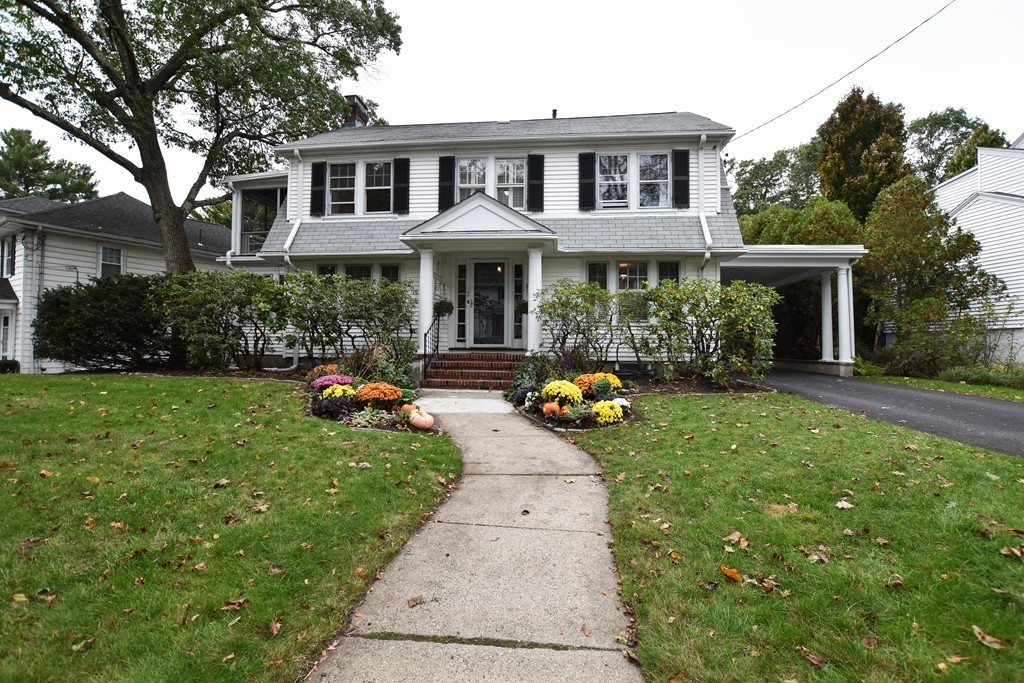 47 Ellison Road Newton, MA 02459 - Photo 1 of 18 a front view of a house with garden and porch