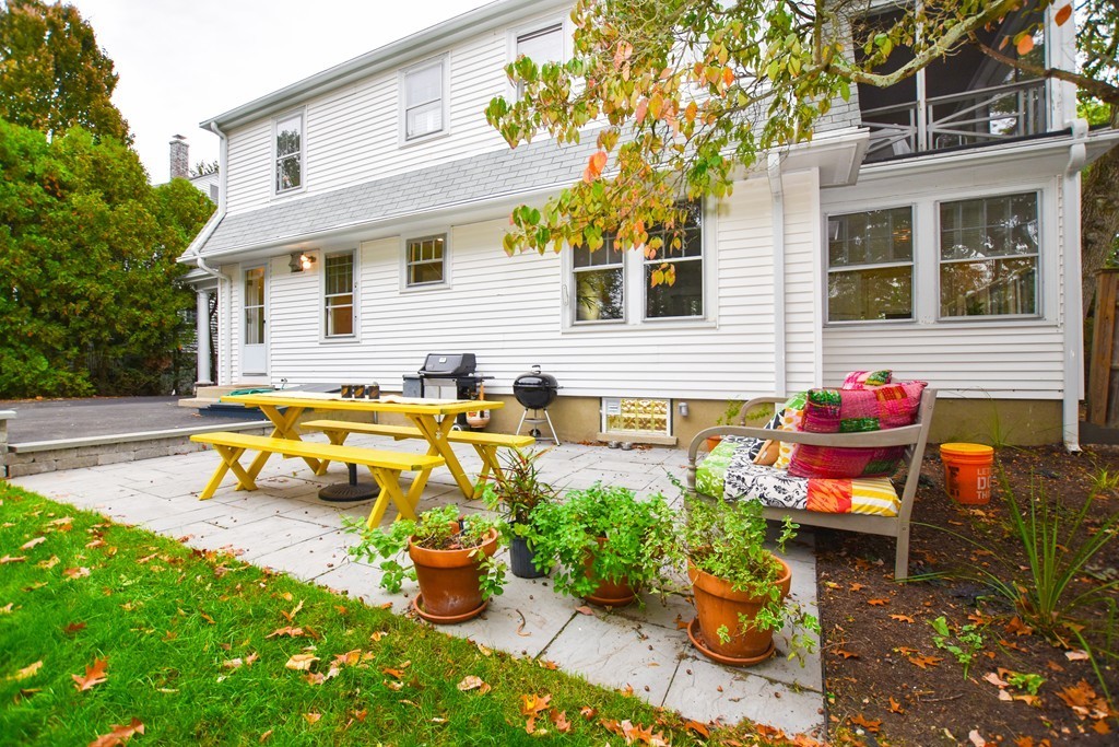 47 Ellison Road Newton, MA 02459 - Photo 18 of 18 a view of a patio with chairs and potted plants