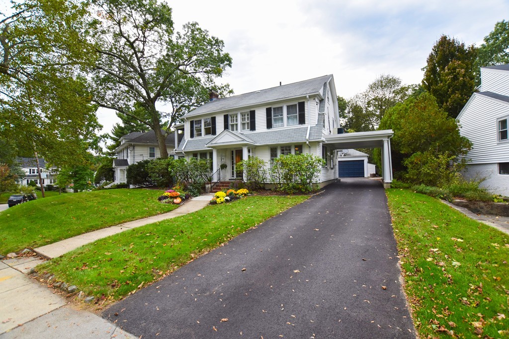 47 Ellison Road Newton, MA 02459 - Photo 2 of 18 a front view of a house with a yard and porch