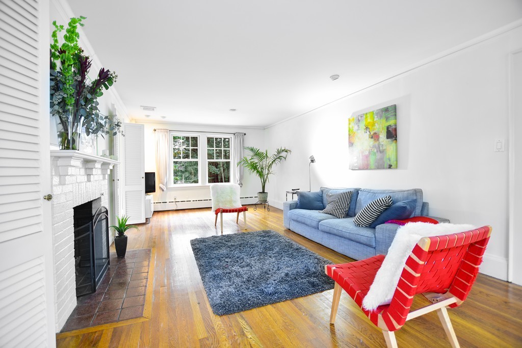 47 Ellison Road Newton, MA 02459 - Photo 4 of 18 a living room with furniture and a fireplace