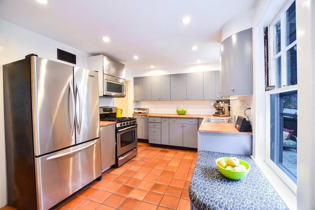 47 Ellison Road Newton, MA 02459 - Photo 7 of 18 a kitchen with stainless steel appliances granite countertop a refrigerator and a sink