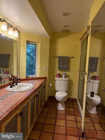 a bathroom with a sink and toilet