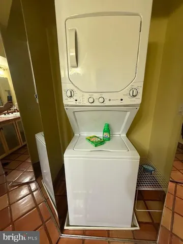 a white toilet sitting next to a bathroom sink and a shower