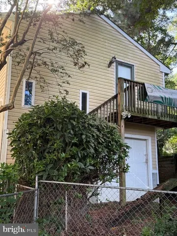 a view of a house with a yard and plants