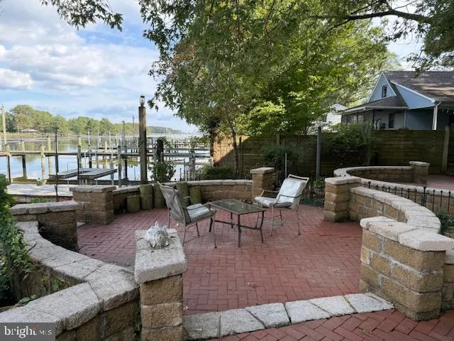 a view of a lake with a table and a bench