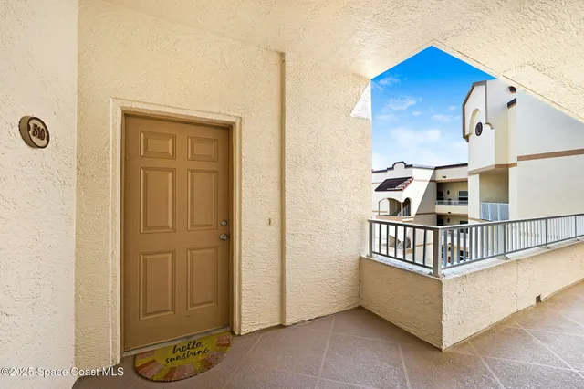 a living room with a couch and a window