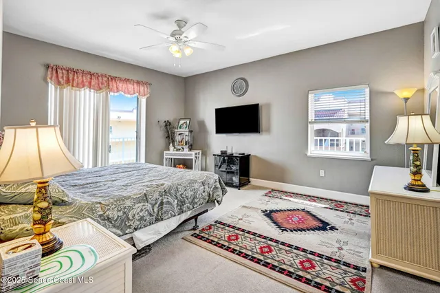 a bedroom with a bed and a mirror on dresser