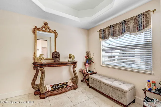 a kitchen with a sink a counter top space cabinets and stainless steel appliances