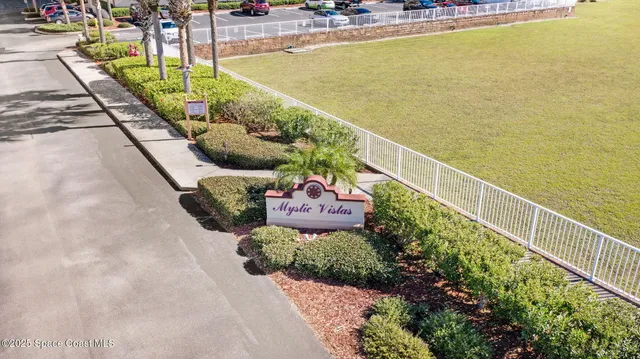 a front view of a house with stainless steel appliances and seating