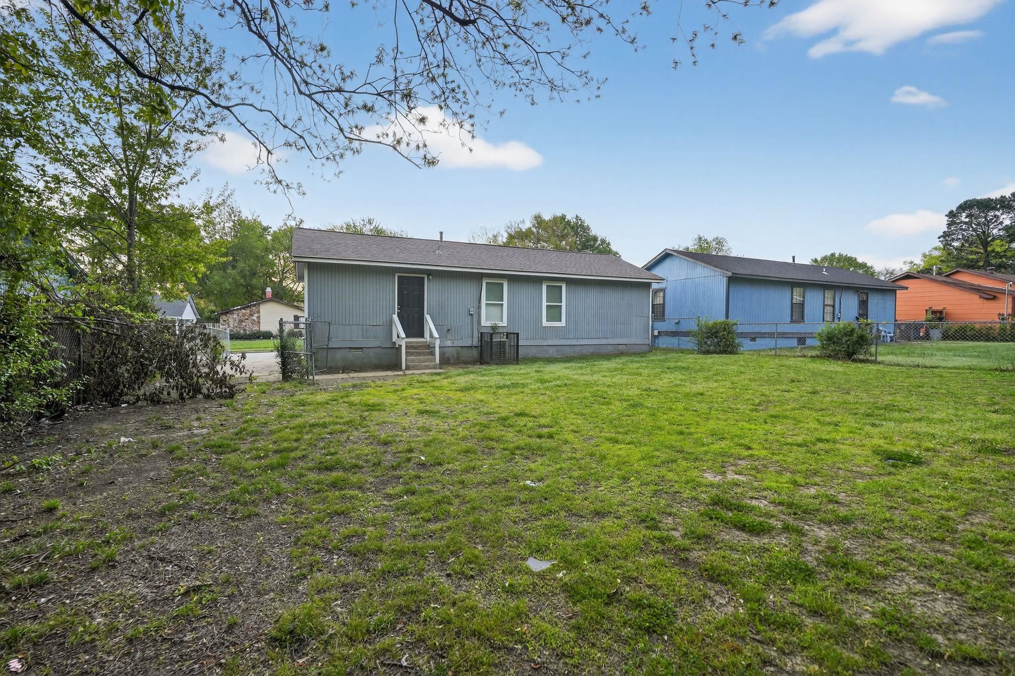 4725 Lofts Road Memphis, TN 38118 - Photo 30 of 32 Rear view of property with a fenced backyard, crawl space, and a gate