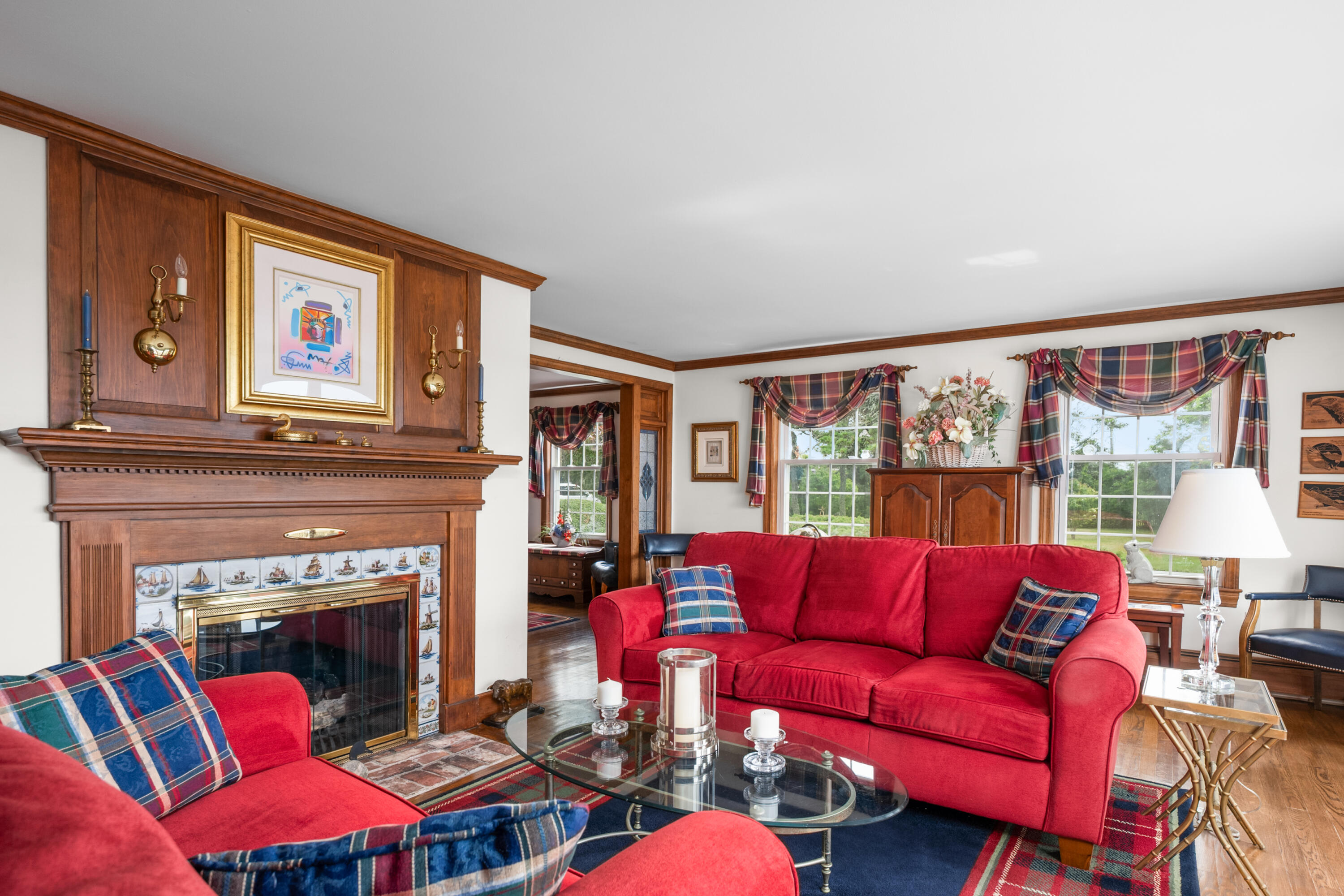 44 Buena Vista Road Chatham, MA 02633 - Photo 24 of 73 a living room with furniture a large window and a fireplace
