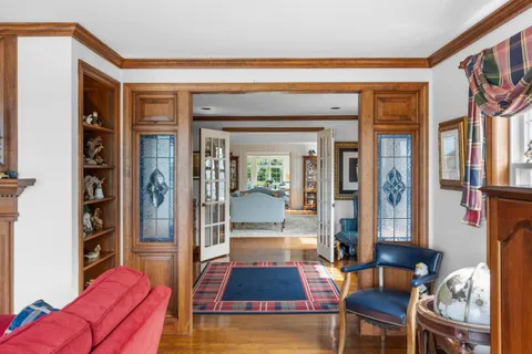 a bedroom with a bed and a flat tv screen on the dresser