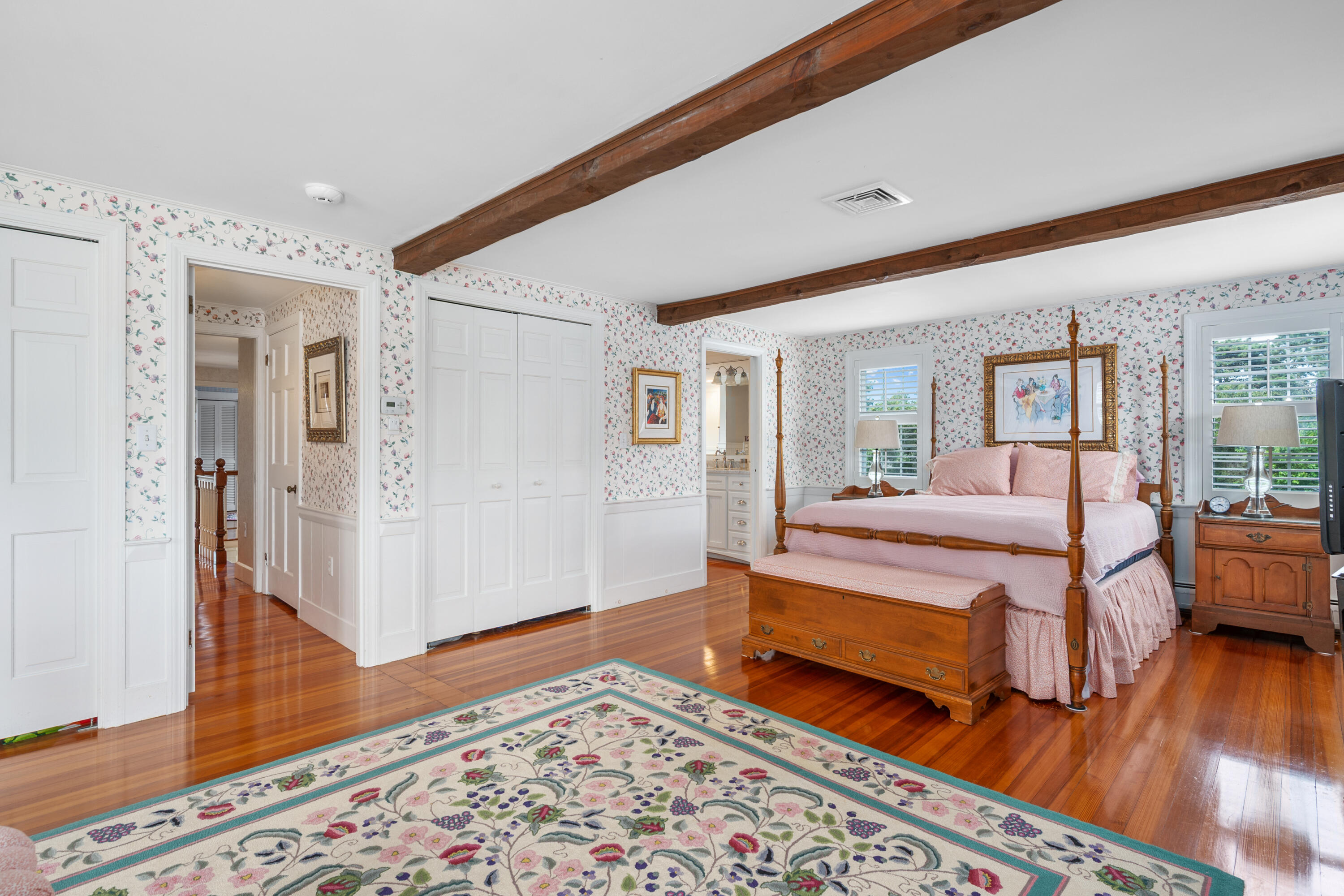 44 Buena Vista Road Chatham, MA 02633 - Photo 32 of 73 a spacious bedroom with a bed and wooden floor