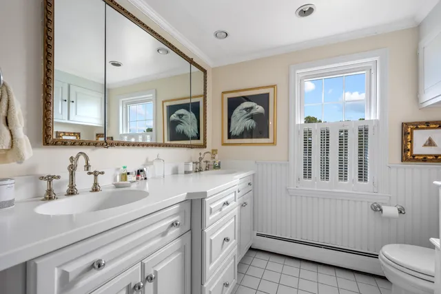 a living room with furniture fireplace and wooden floor