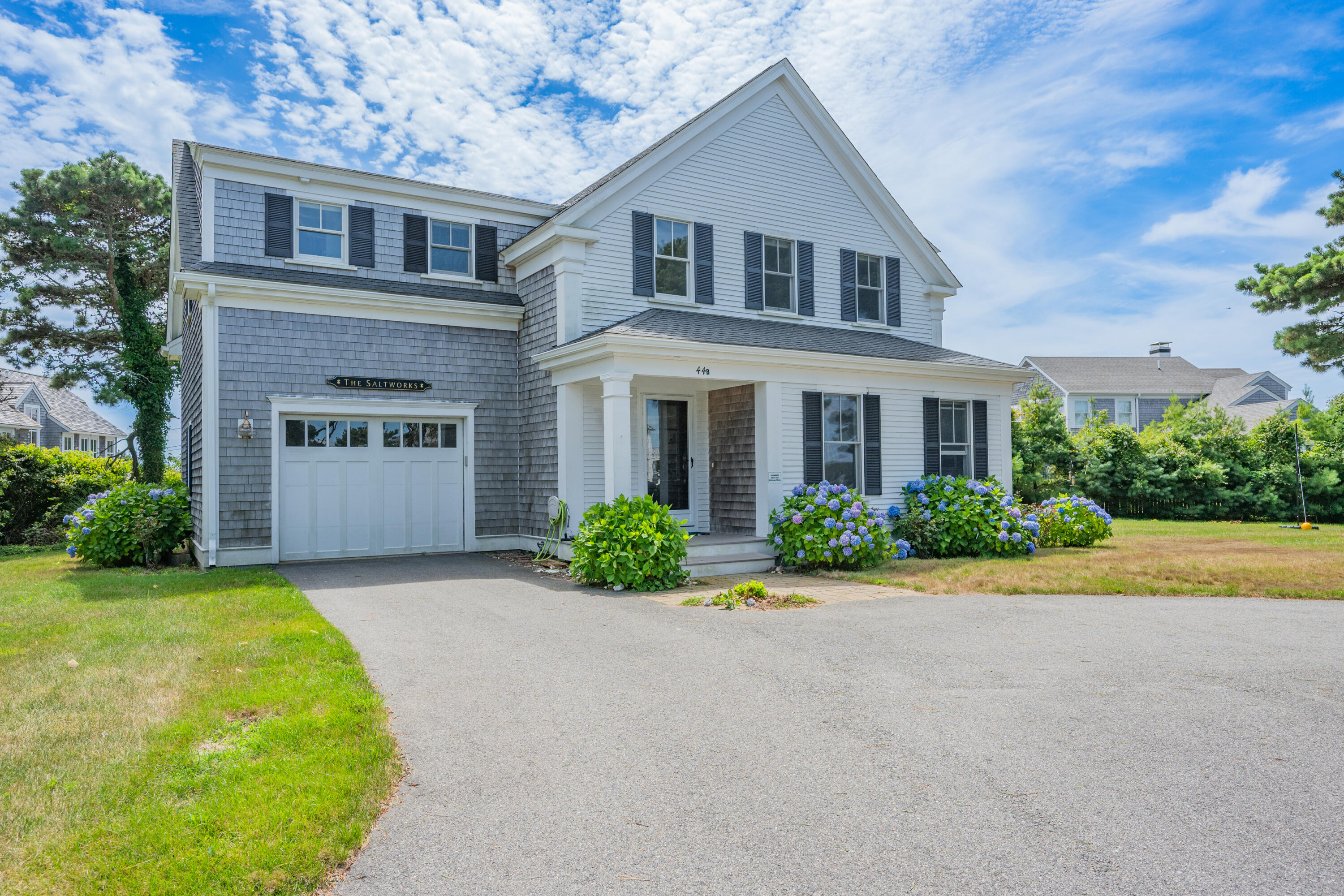 44 Buena Vista Road Chatham, MA 02633 - Photo 44 of 73 a front view of a house with garden