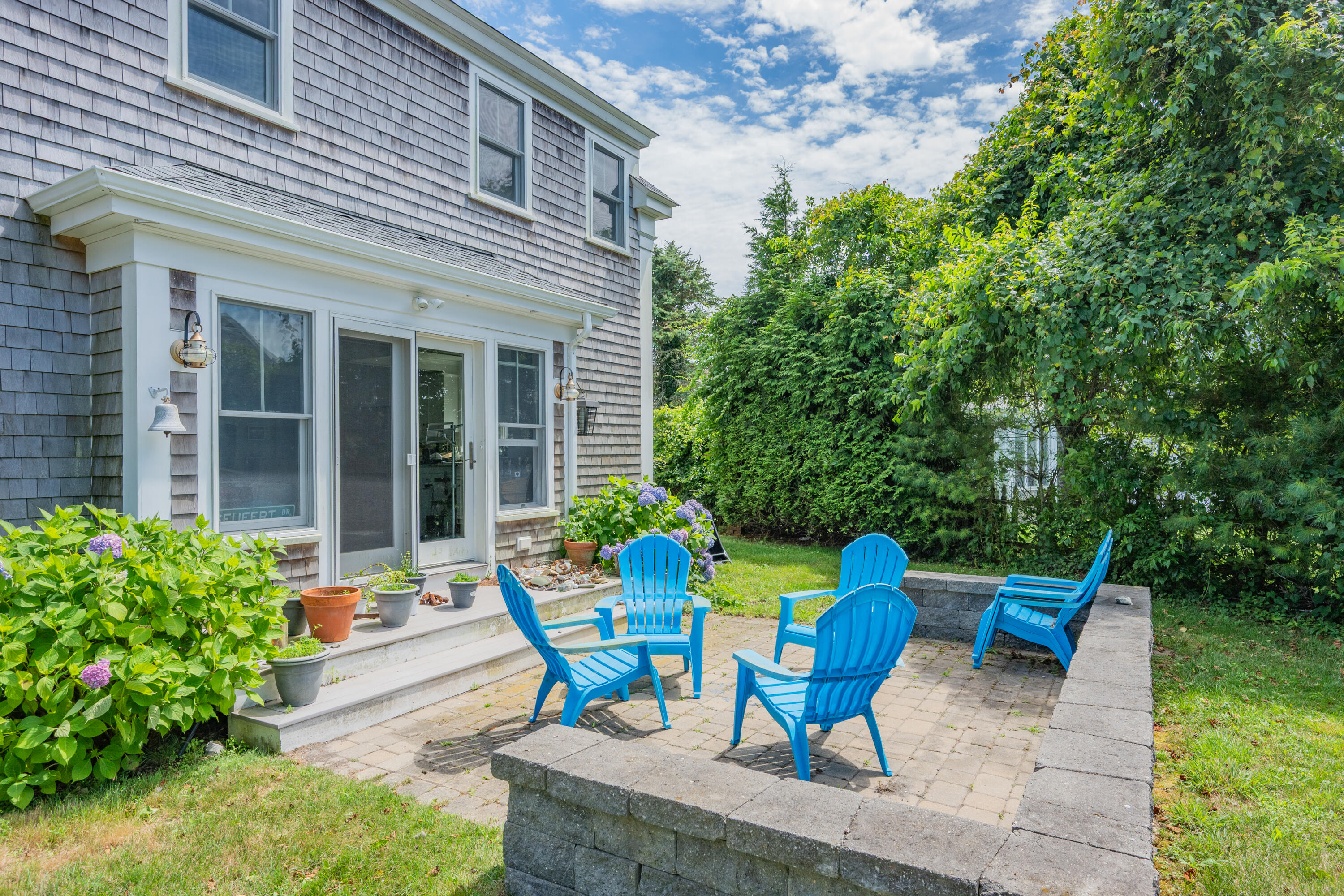44 Buena Vista Road Chatham, MA 02633 - Photo 46 of 73 a view of a chair and table in backyard of the house
