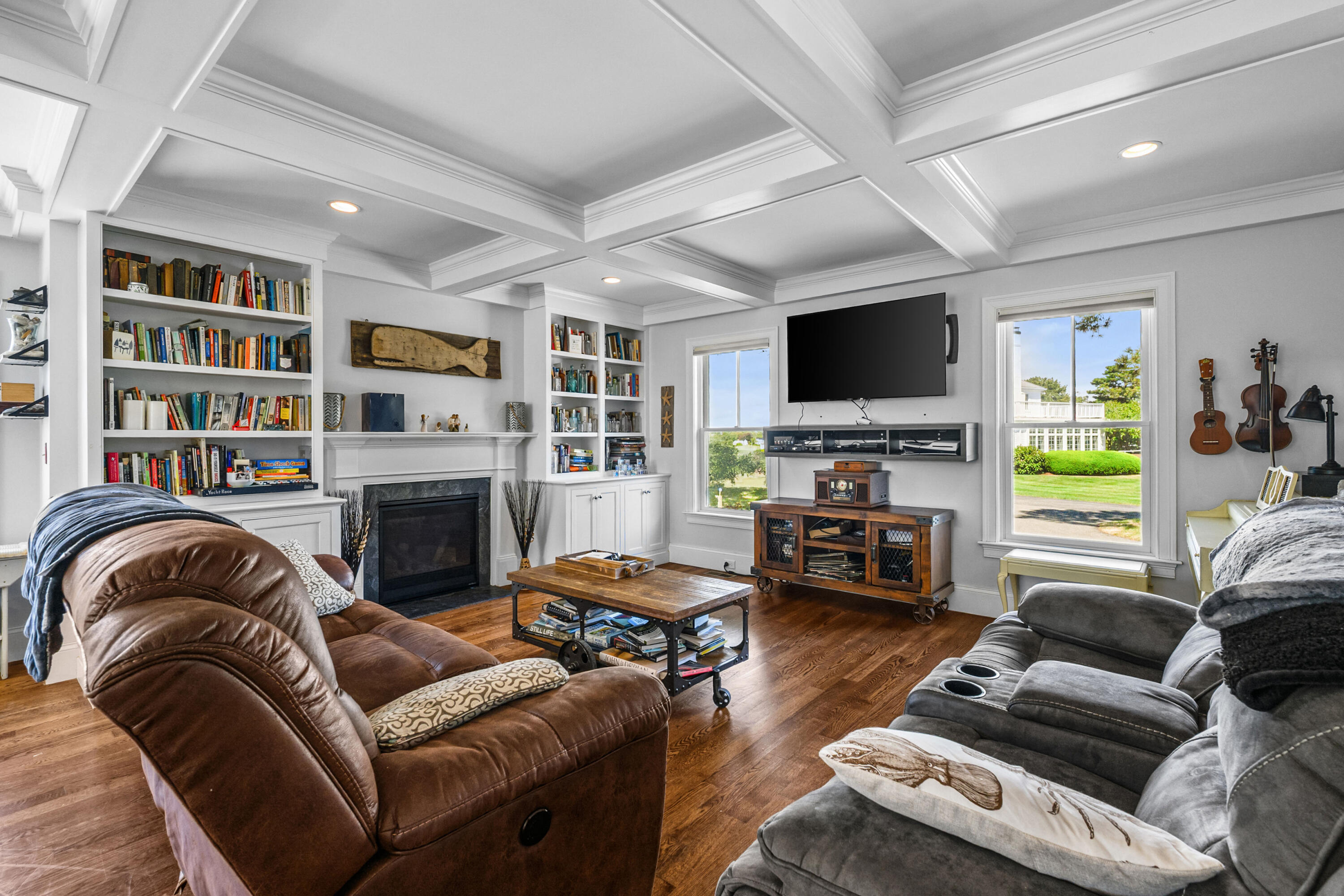 44 Buena Vista Road Chatham, MA 02633 - Photo 47 of 73 a living room with furniture a fireplace and a flat screen tv