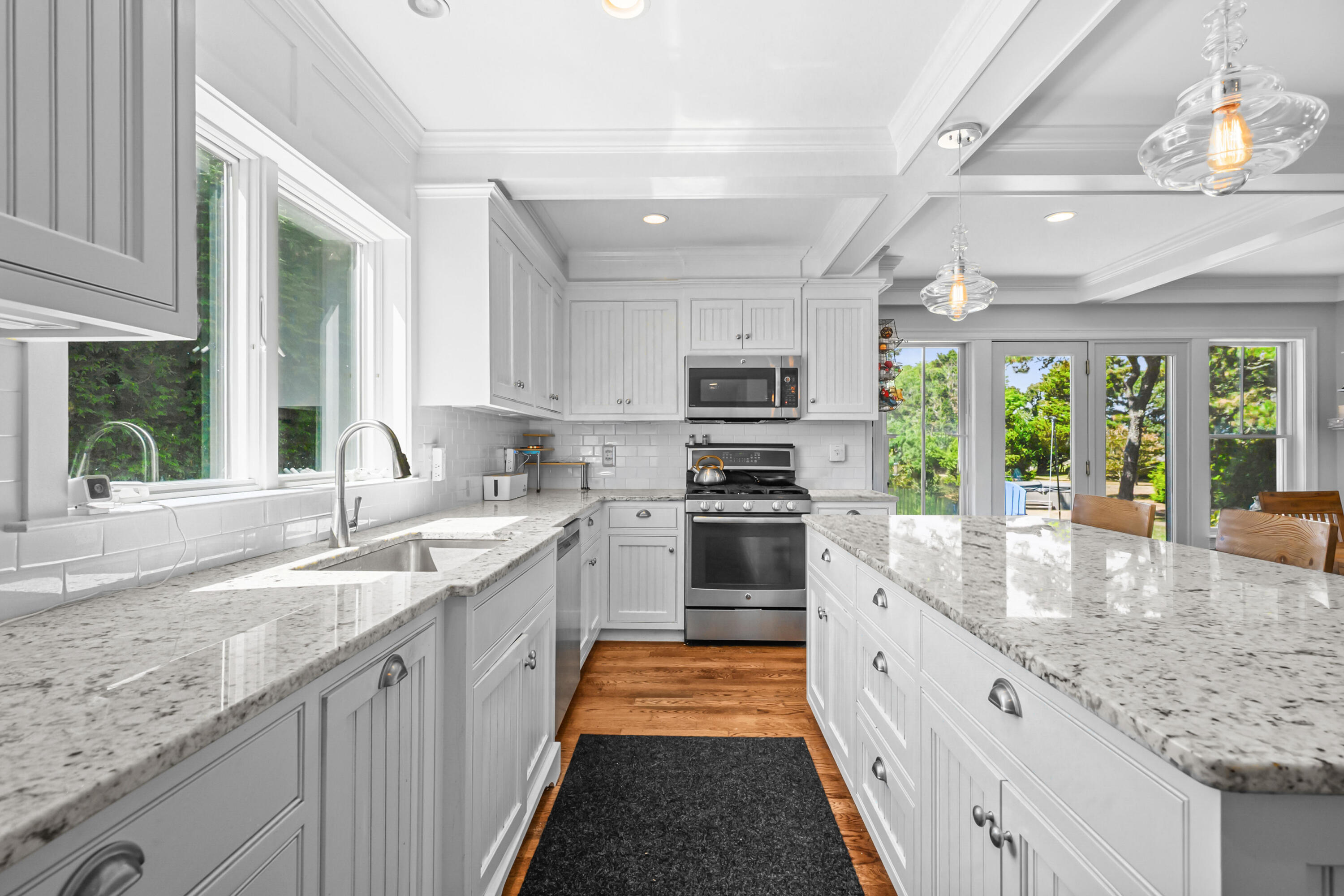 44 Buena Vista Road Chatham, MA 02633 - Photo 51 of 73 a kitchen with stainless steel appliances granite countertop sink stove and refrigerator