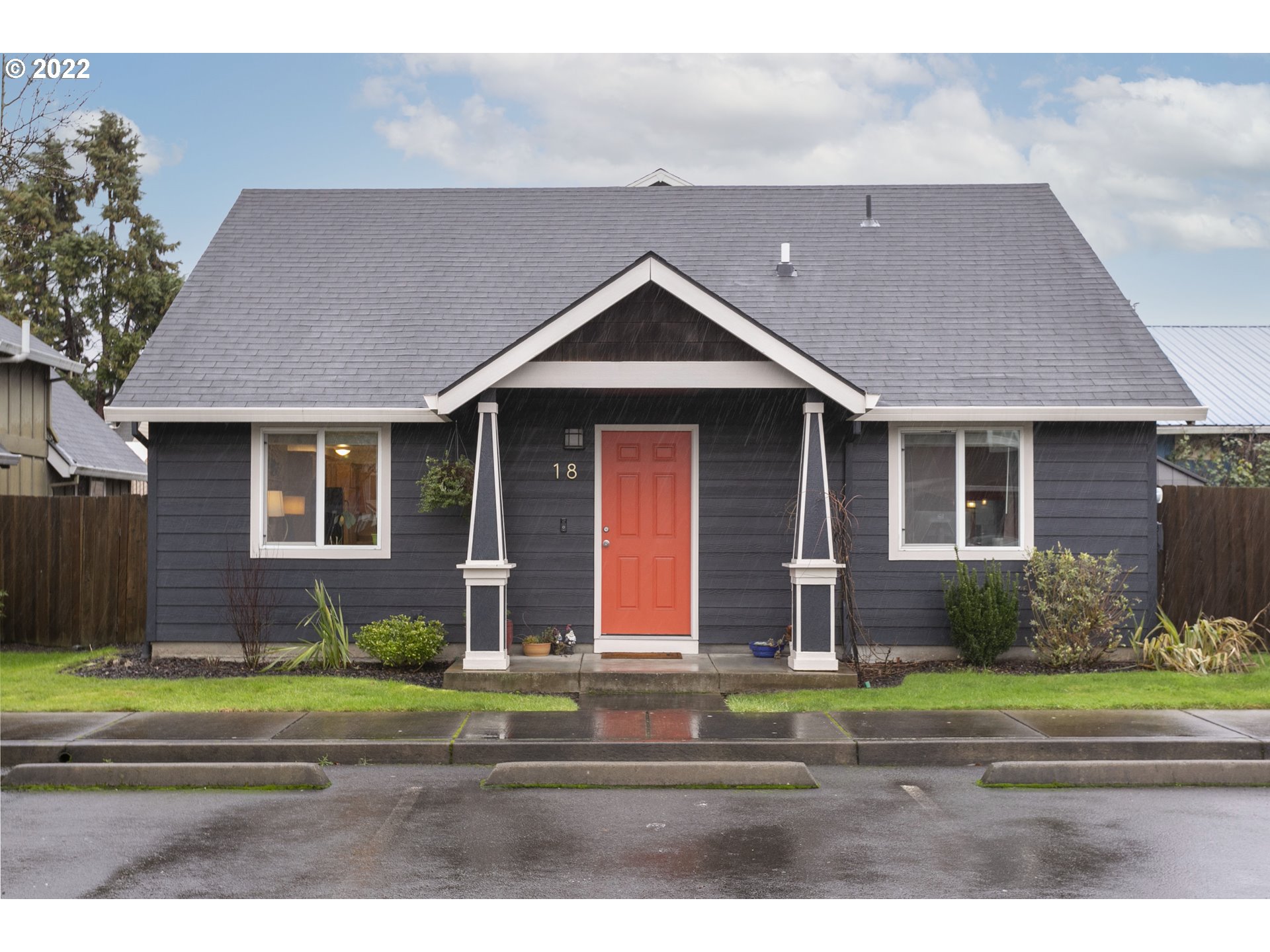 601 West 1st Street, Unit 18 Newberg, OR 97132 - Photo 1 of 21 a front view of a house with a yard