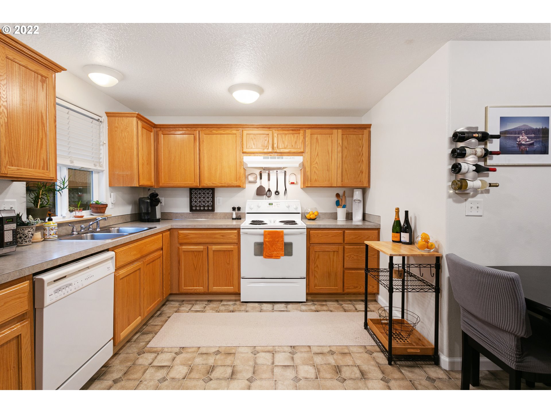 601 West 1st Street, Unit 18 Newberg, OR 97132 - Photo 11 of 21 a kitchen with a sink counter top space cabinets and appliances