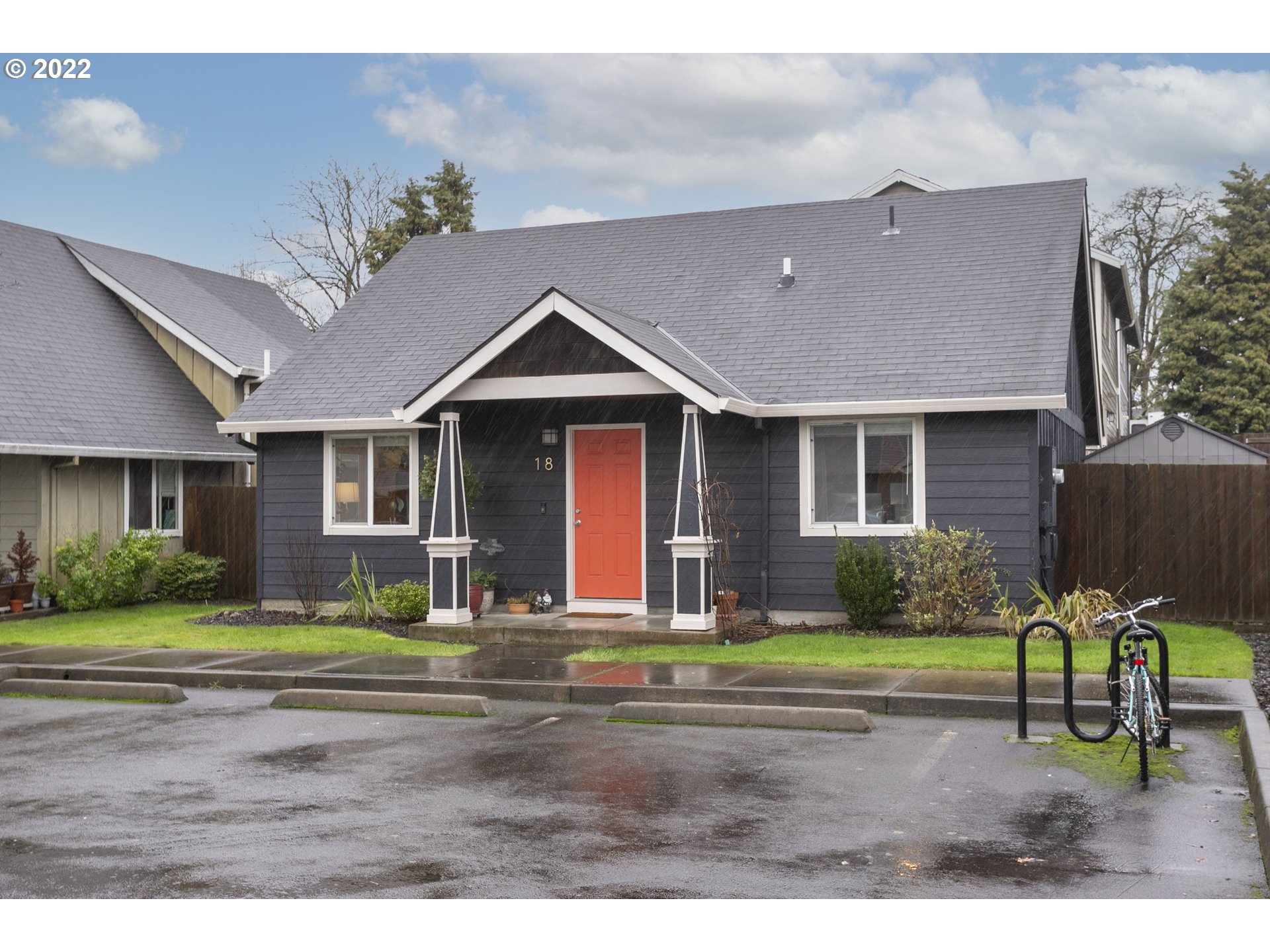 601 West 1st Street, Unit 18 Newberg, OR 97132 - Photo 2 of 21 a front view of a house with garden