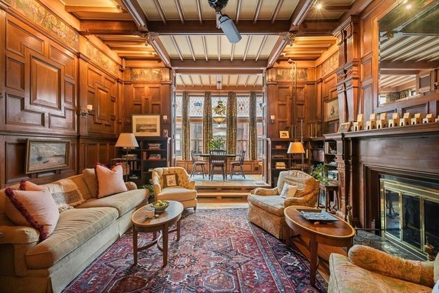 a outdoor living space with patio furniture and a fireplace