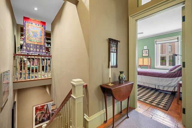 a front view of a house with outdoor seating