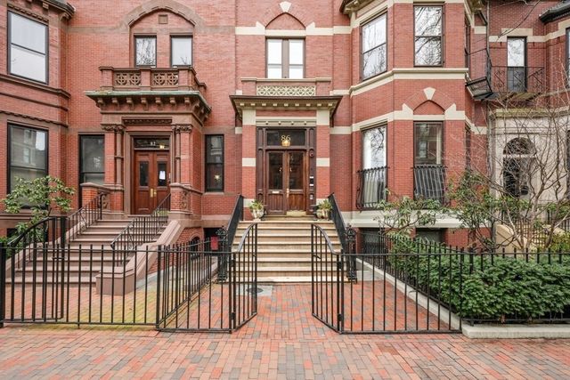 a view of a building with sitting area