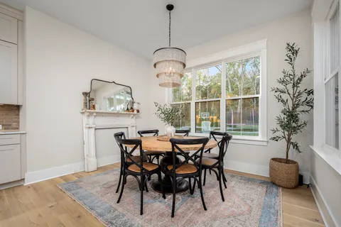 a living room with furniture and a lamp