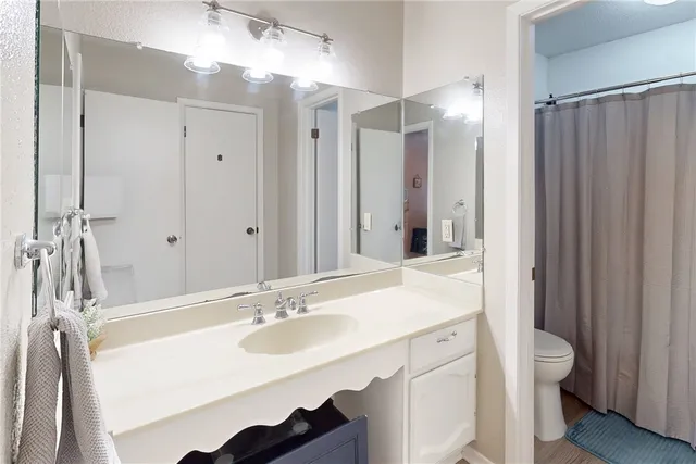 a bathroom with a sink double vanity and a mirror