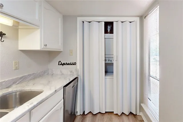 a kitchen with a sink and a refrigerator