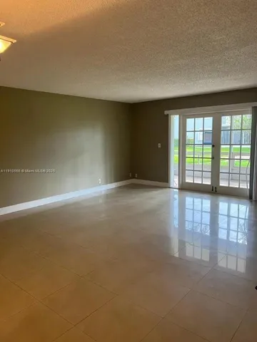 a kitchen with a sink and a refrigerator