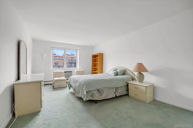 a bedroom with bed and window