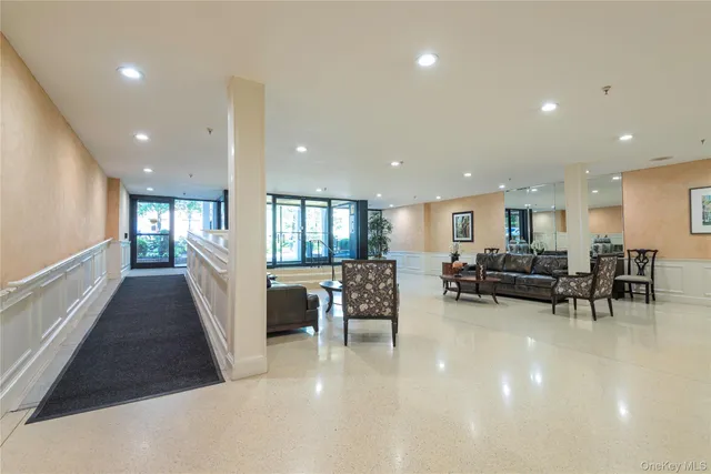 a view of a dining room with furniture and a living room