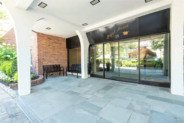 a view of an empty room with a fireplace and a large window